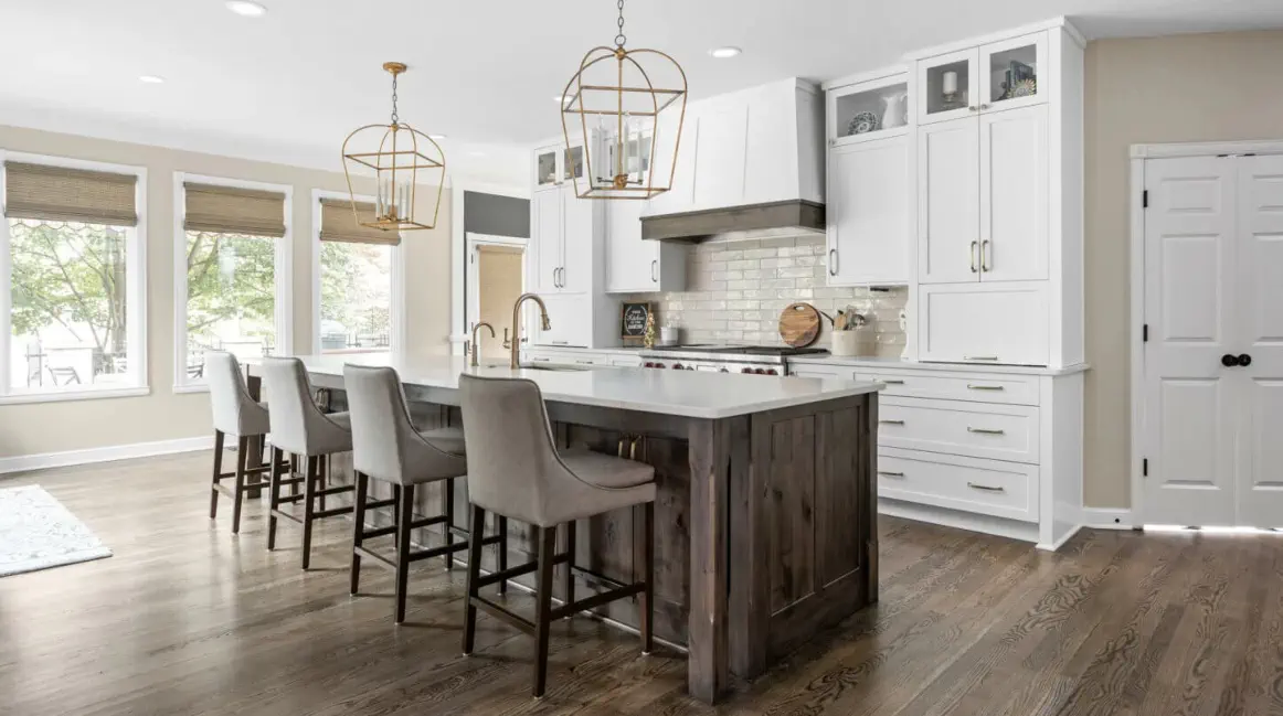 white kitchen cabinets and a large island